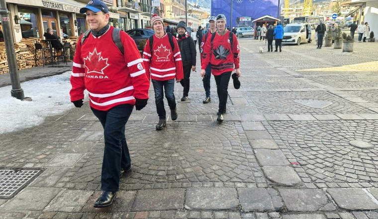 Olympic fans shed winter coats as climate change raises temperatures in Cortina