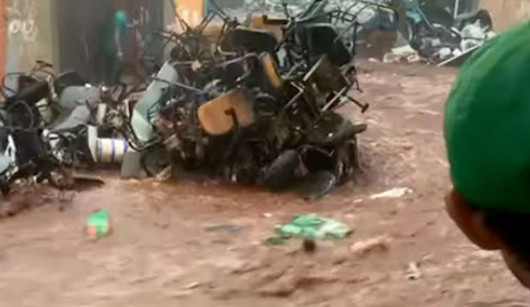 Video: Brazil floods send torrent of waste down street