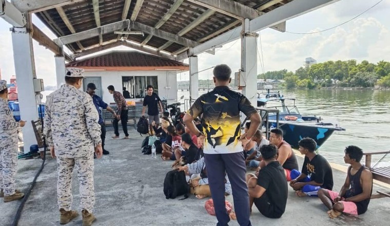 Malaysia searches for 14 missing Indonesians after a migrant boat sinks