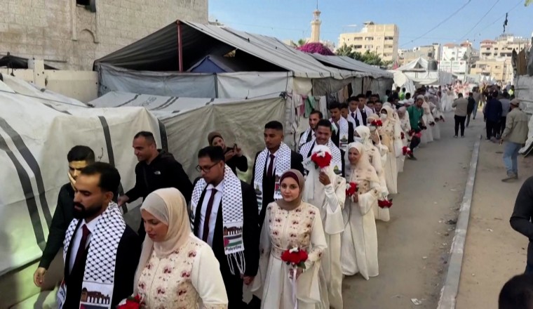 Mass wedding brings brief joy to couples in devastated Gaza