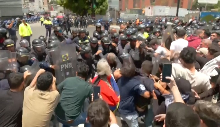 Venezuelan protesters clash with police at rally for political prisoners